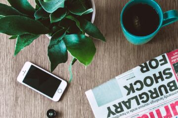iphone on brown wooden table